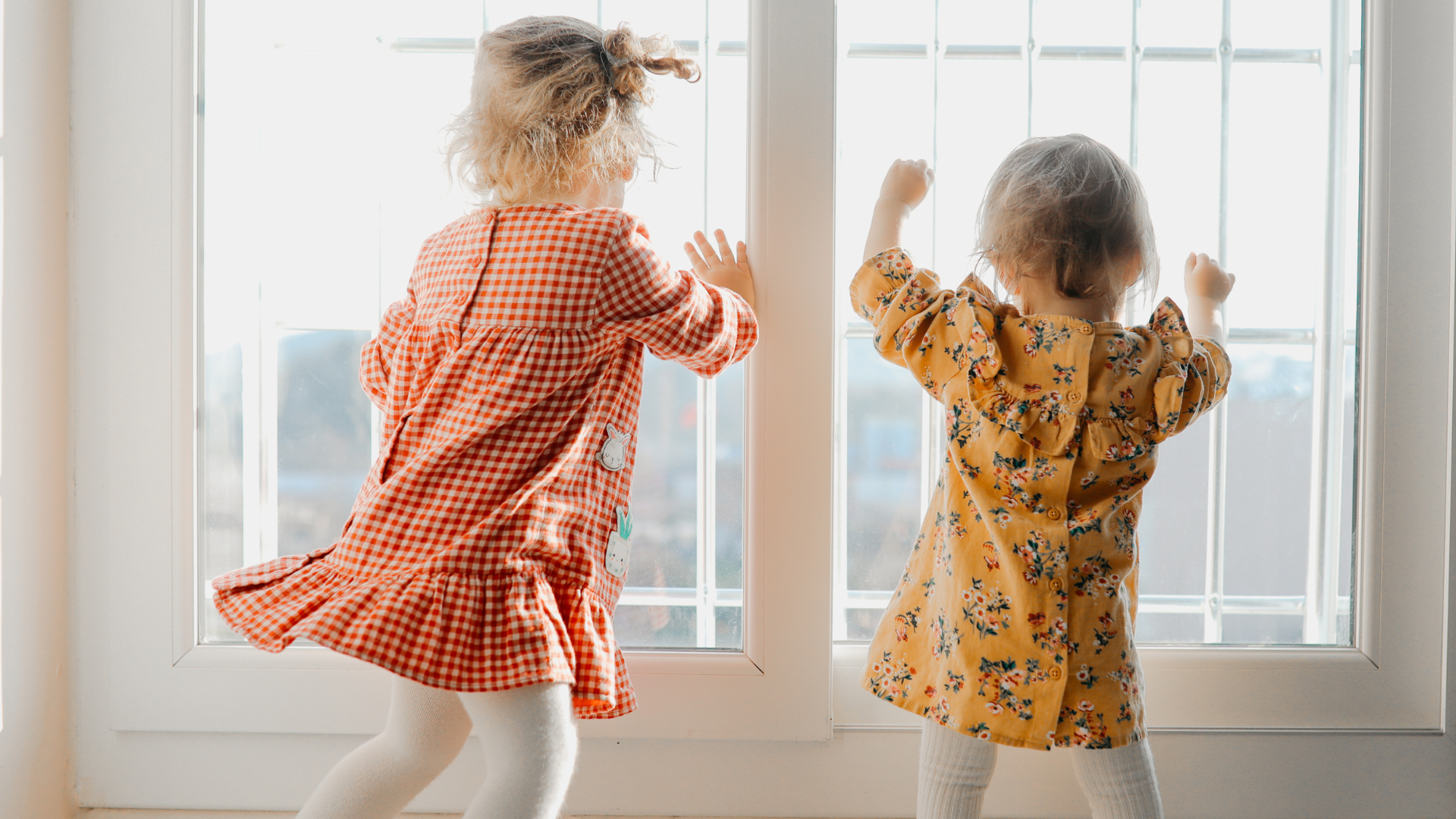 two young children dancing in an virtual activity 