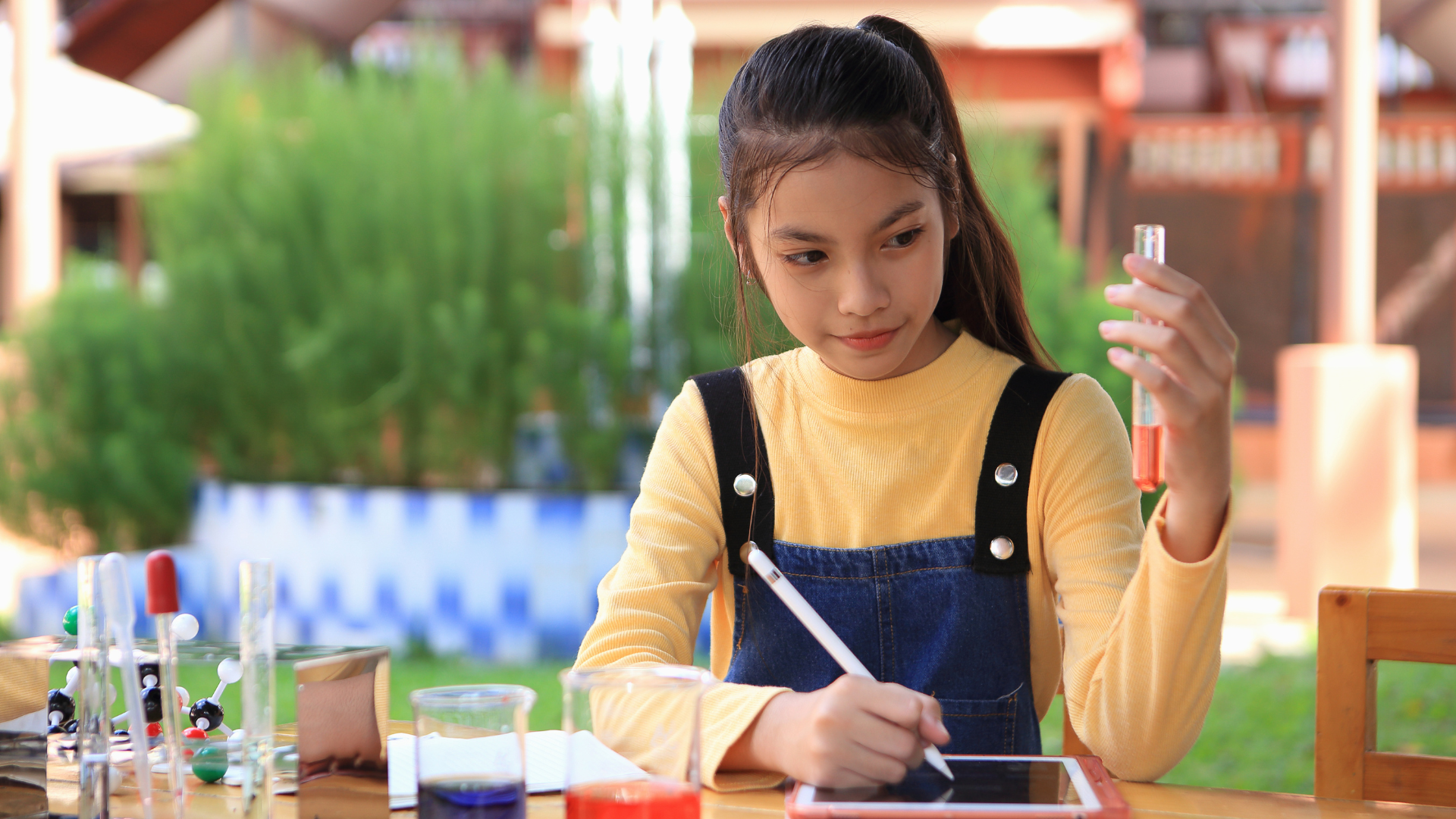Girl doing a science experiment in the garden
