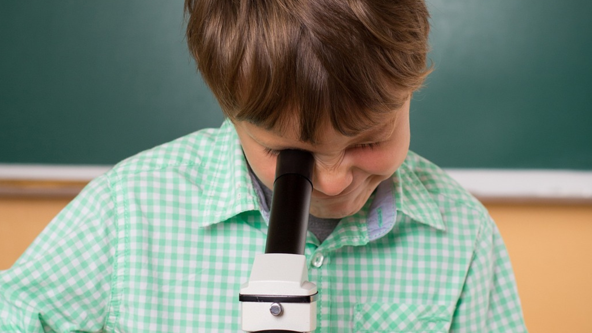 Kid doing a science experiment at home